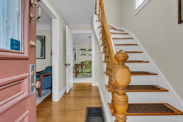 45 Graves Ave, Guilford, CT 06437 - foyer entrance with stairs, wood finished floors, and ornamental molding