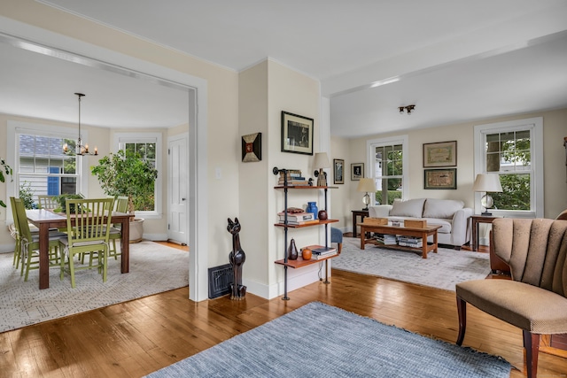 45 Graves Ave, Guilford, CT 06437 - living room featuring wood-type flooring and a chandelier