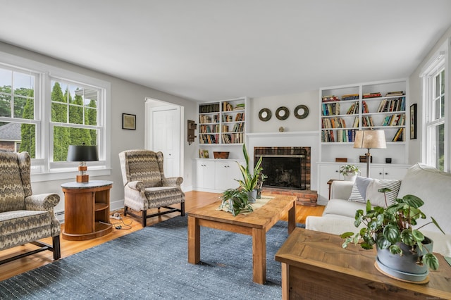 45 Graves Ave, Guilford, CT 06437 - living room featuring plenty of natural light, a fireplace, and wood finished floors