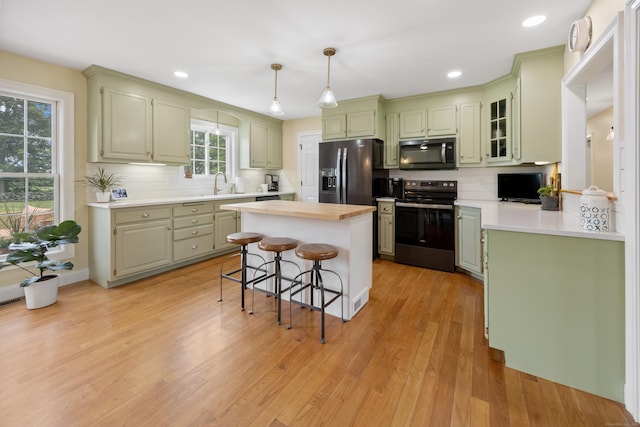 40 Briggs Rd, Lebanon, CT 06249 - kitchen with stainless steel appliances, backsplash, light countertops, and recessed lighting