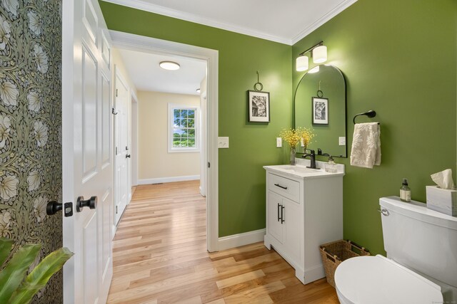 40 Briggs Rd, Lebanon, CT 06249 - bathroom featuring vanity, wood finished floors, and ornamental molding