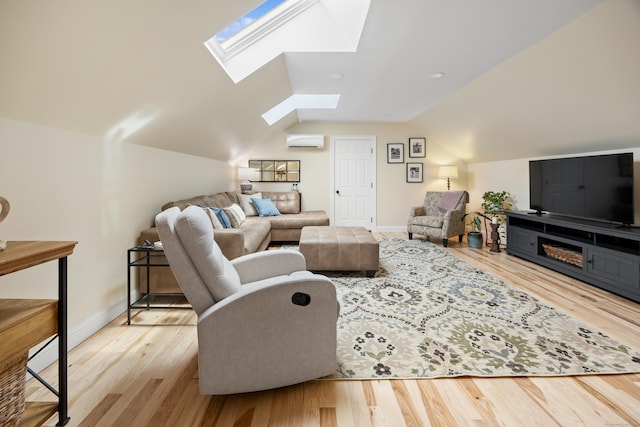 40 Briggs Rd, Lebanon, CT 06249 - living area featuring a skylight, a wall unit AC, vaulted ceiling, and wood finished floors