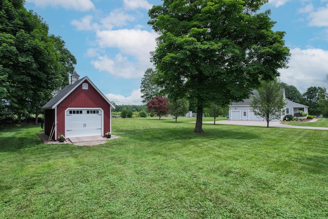 40 Briggs Rd, Lebanon, CT 06249 - view of green lawn with a garage