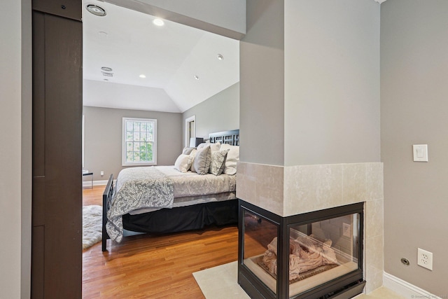 25 Encampment Pl, Ridgefield, CT 06877 - bedroom with light wood-style flooring, lofted ceiling, and recessed lighting