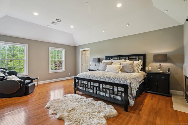 25 Encampment Pl, Ridgefield, CT 06877 - bedroom featuring vaulted ceiling, multiple windows, wood finished floors, recessed lighting, and bar area