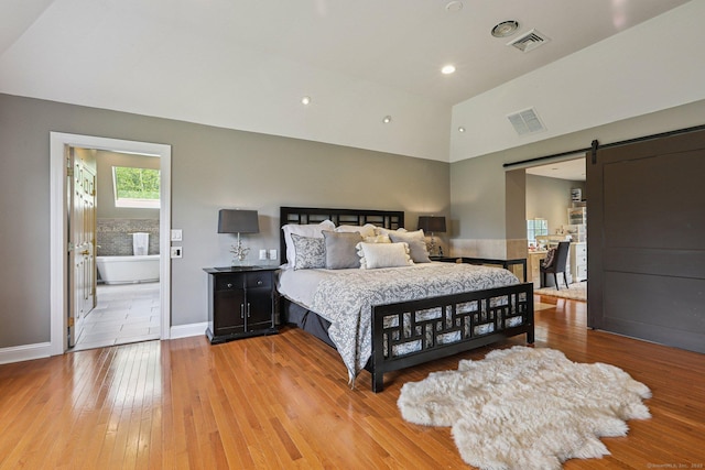 25 Encampment Pl, Ridgefield, CT 06877 - bedroom featuring a barn door, light wood-type flooring, high vaulted ceiling, and recessed lighting