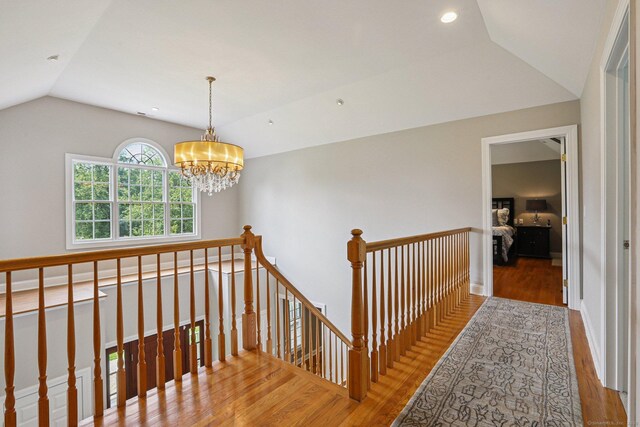 25 Encampment Pl, Ridgefield, CT 06877 - hall featuring an upstairs landing, wood finished floors, lofted ceiling, a chandelier, and recessed lighting