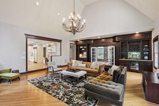25 Encampment Pl, Ridgefield, CT 06877 - living area featuring a chandelier, light wood-style floors, and high vaulted ceiling