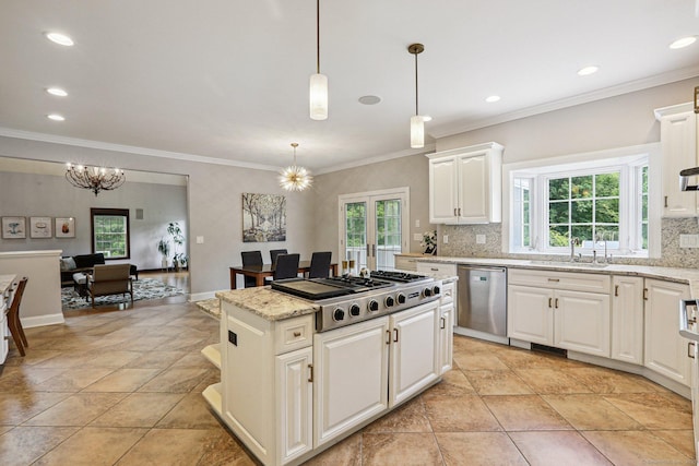 25 Encampment Pl, Ridgefield, CT 06877 - kitchen featuring appliances with stainless steel finishes, plenty of natural light, tasteful backsplash, crown molding, and recessed lighting