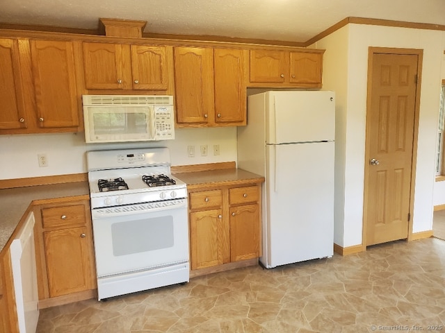 252 Old Canterbury Tpke Lot 19, Norwich, CT 06360 - kitchen with white appliances, brown cabinets, and ornamental molding