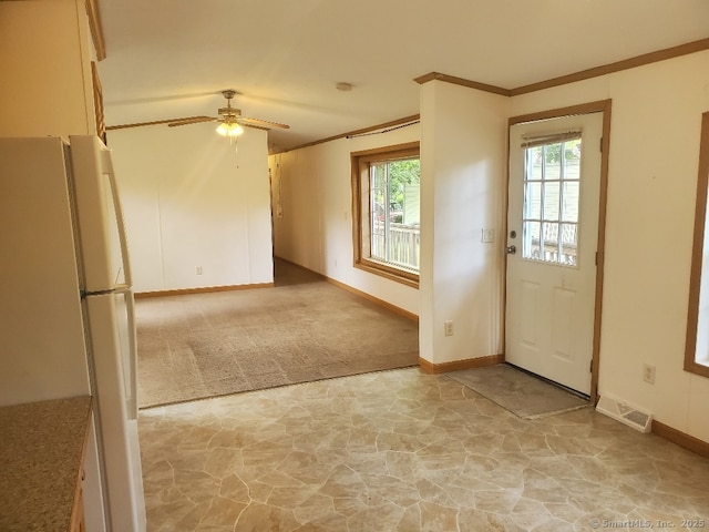 252 Old Canterbury Tpke Lot 19, Norwich, CT 06360 - foyer entrance with stone flooring, a ceiling fan, ornamental molding, and light colored carpet