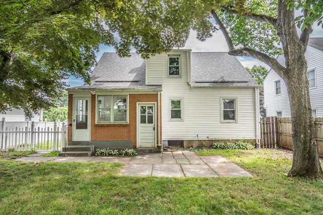 30 Jackson Ave, West Hartford, CT 06110 - rear view of house with entry steps, roof with shingles, and a patio