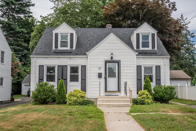 30 Jackson Ave, West Hartford, CT 06110 - new england style home with roof with shingles, a chimney, and view of scattered trees