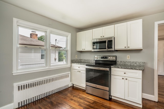 30 Jackson Ave, West Hartford, CT 06110 - kitchen with stainless steel appliances, radiator, dark wood finished floors, and white cabinets