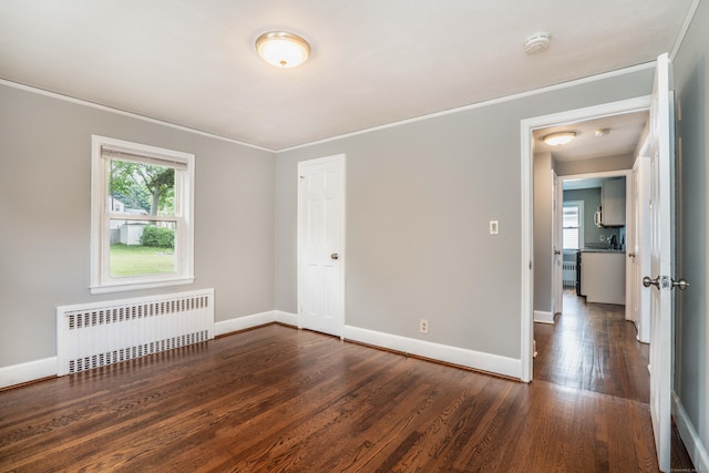 30 Jackson Ave, West Hartford, CT 06110 - unfurnished room featuring radiator heating unit, a smoke detector, ornamental molding, and wood finished floors