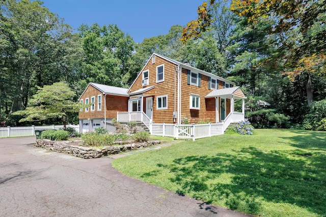 39 Clover Dr, Wilton, CT 06897 - view of front of house with an attached garage and driveway