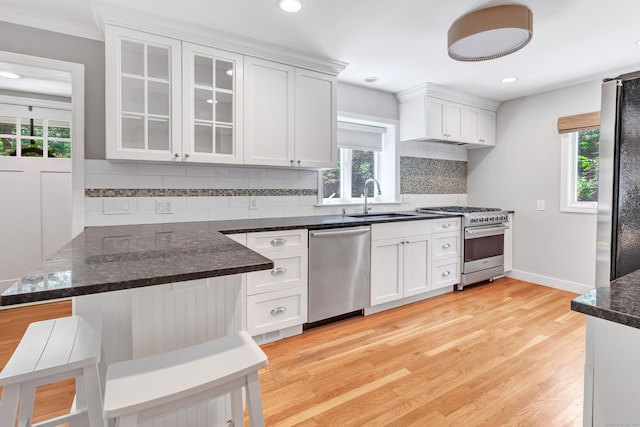 39 Clover Dr, Wilton, CT 06897 - kitchen featuring stainless steel appliances, plenty of natural light, white cabinets, and recessed lighting