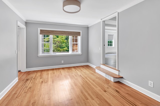 39 Clover Dr, Wilton, CT 06897 - empty room featuring ornamental molding, light wood-type flooring, and baseboard heating