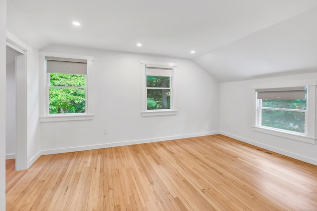 39 Clover Dr, Wilton, CT 06897 - spare room with lofted ceiling, plenty of natural light, wood-type flooring, and recessed lighting