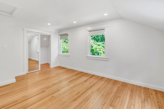 39 Clover Dr, Wilton, CT 06897 - unfurnished bedroom with hardwood / wood-style flooring, vaulted ceiling, a closet, and recessed lighting