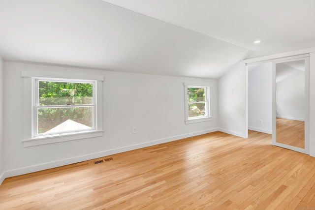 39 Clover Dr, Wilton, CT 06897 - unfurnished bedroom with vaulted ceiling and wood finished floors