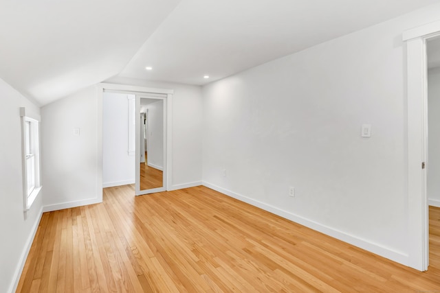 39 Clover Dr, Wilton, CT 06897 - unfurnished room with light wood-style flooring, vaulted ceiling, and recessed lighting
