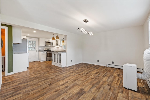 70 Laurel Hill Dr, Woodstock, CT 06282 - unfurnished living room featuring dark wood-style floors, baseboard heating, and recessed lighting