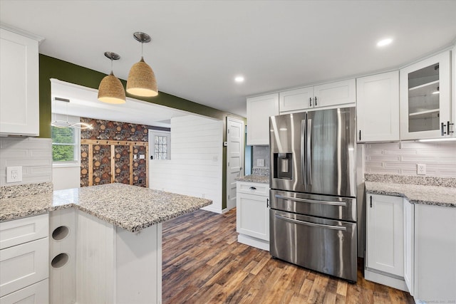 70 Laurel Hill Dr, Woodstock, CT 06282 - kitchen featuring stainless steel fridge, white cabinets, tasteful backsplash, glass insert cabinets, and dark wood-type flooring