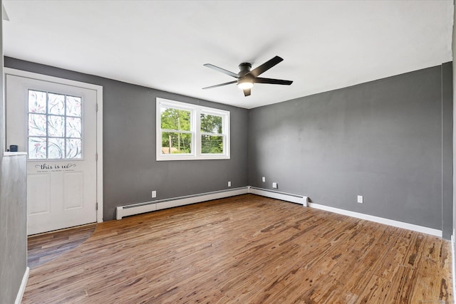 70 Laurel Hill Dr, Woodstock, CT 06282 - empty room featuring wood finished floors, ceiling fan, and a baseboard heating unit