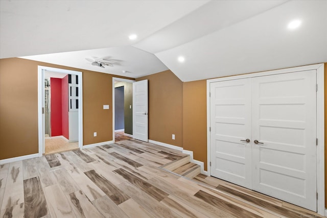 70 Laurel Hill Dr, Woodstock, CT 06282 - unfurnished bedroom with light wood-type flooring, recessed lighting, a closet, and vaulted ceiling