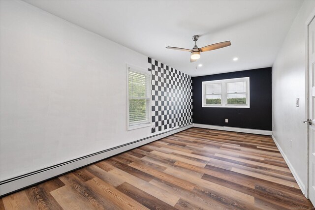 70 Laurel Hill Dr, Woodstock, CT 06282 - empty room with wood finished floors, a baseboard heating unit, ceiling fan, and recessed lighting
