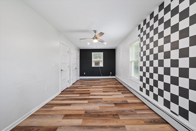 70 Laurel Hill Dr, Woodstock, CT 06282 - unfurnished room with a baseboard radiator, ceiling fan, wood finished floors, an accent wall, and recessed lighting
