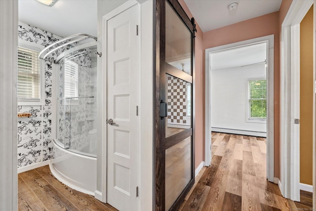 70 Laurel Hill Dr, Woodstock, CT 06282 - full bath with a baseboard radiator, wood finished floors, and combined bath / shower with glass door
