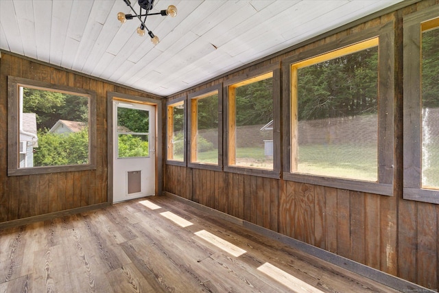 70 Laurel Hill Dr, Woodstock, CT 06282 - unfurnished sunroom featuring plenty of natural light, wooden walls, wood finished floors, lofted ceiling, and a chandelier