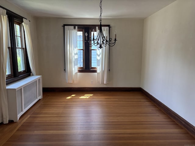 60 Ardmore St, Hamden, CT 06517 - unfurnished dining area with dark wood-type flooring and a chandelier