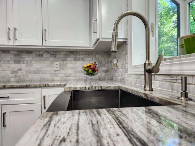3 Old Woods Rd, Brookfield, CT 06804 - kitchen view of tasteful backsplash, white cabinets, and light stone countertops