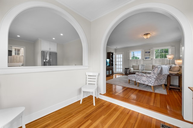 5 S Main St, Essex, CT 06426 - sitting room with wood finished floors, arched walkways, ornamental molding, and recessed lighting