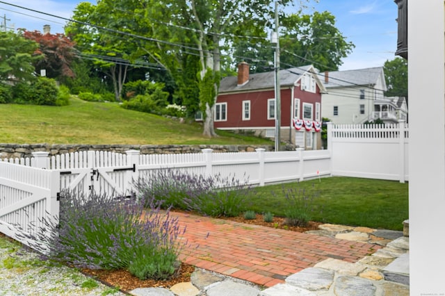 5 S Main St, Essex, CT 06426 - fenced yard featuring a gate and a patio area