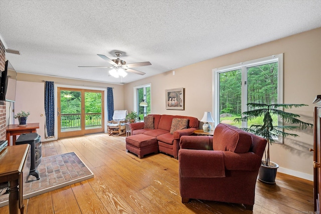 853 Pole Bridge Rd, Woodstock, CT 06281 - living room featuring wood-type flooring, a textured ceiling, and ceiling fan