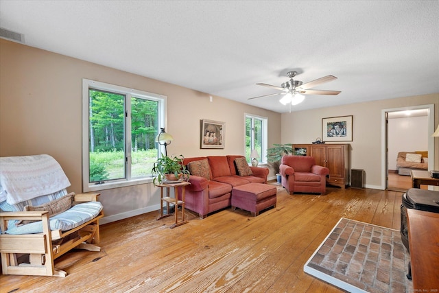 853 Pole Bridge Rd, Woodstock, CT 06281 - living area with light wood-style floors and ceiling fan