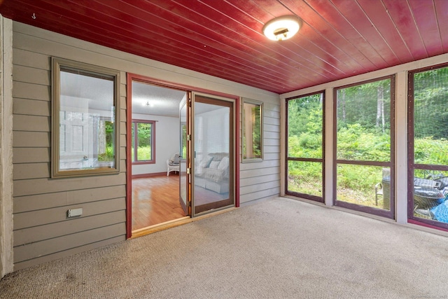 853 Pole Bridge Rd, Woodstock, CT 06281 - unfurnished sunroom featuring carpet floors, wood walls, and wood ceiling