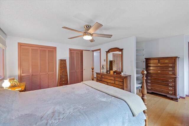 853 Pole Bridge Rd, Woodstock, CT 06281 - bedroom featuring light wood-type flooring, two closets, and ceiling fan