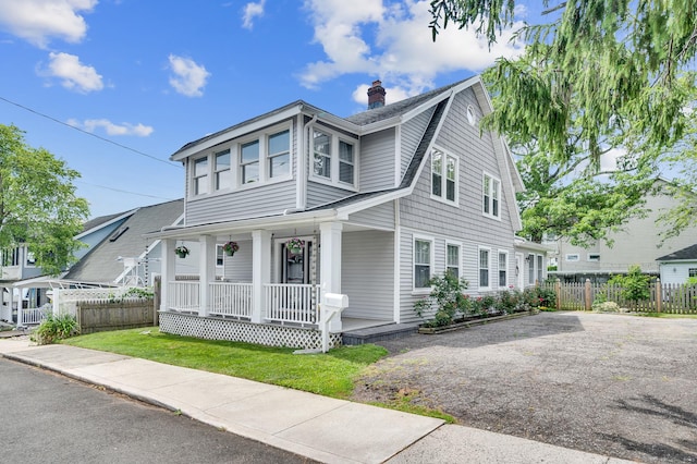 12 Scott St, West Haven, CT 06516 - view of front facade featuring a porch, a chimney, and a shingled roof
