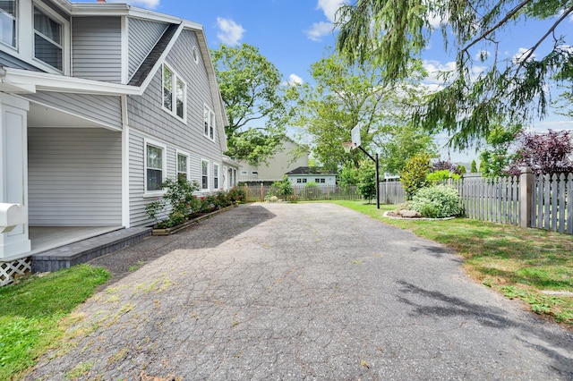 12 Scott St, West Haven, CT 06516 - view of home's exterior with a fenced backyard, a wooden deck, and a patio