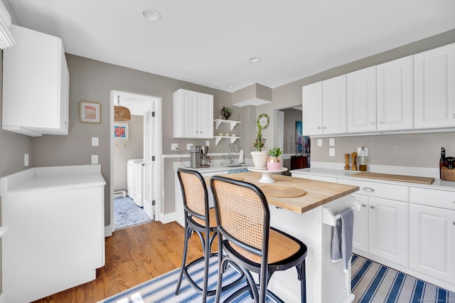 12 Scott St, West Haven, CT 06516 - kitchen with white cabinets, recessed lighting, open shelves, and light wood-type flooring