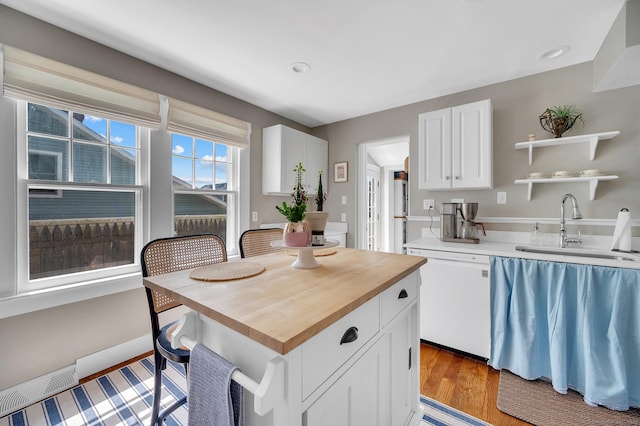 12 Scott St, West Haven, CT 06516 - kitchen with dishwasher, wooden counters, white cabinets, light wood finished floors, and open shelves