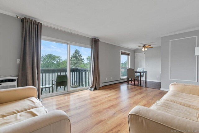153 Marconi Ave Unit 153, Bridgeport, CT 06606 - living room featuring ornamental molding, wood finished floors, a ceiling fan, and a baseboard heating unit