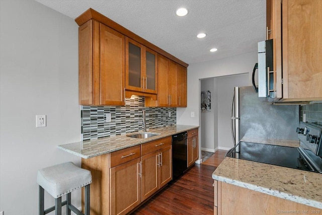 153 Marconi Ave Unit 153, Bridgeport, CT 06606 - kitchen featuring black dishwasher, range with electric cooktop, light stone countertops, tasteful backsplash, and glass insert cabinets
