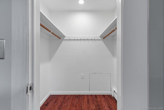153 Marconi Ave Unit 153, Bridgeport, CT 06606 - spacious closet featuring a baseboard heating unit and wood finished floors