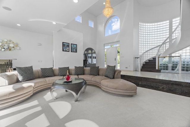 45 Brookview Ct, Groton, CT 06340 - carpeted living room featuring stairway, healthy amount of natural light, a high ceiling, and recessed lighting